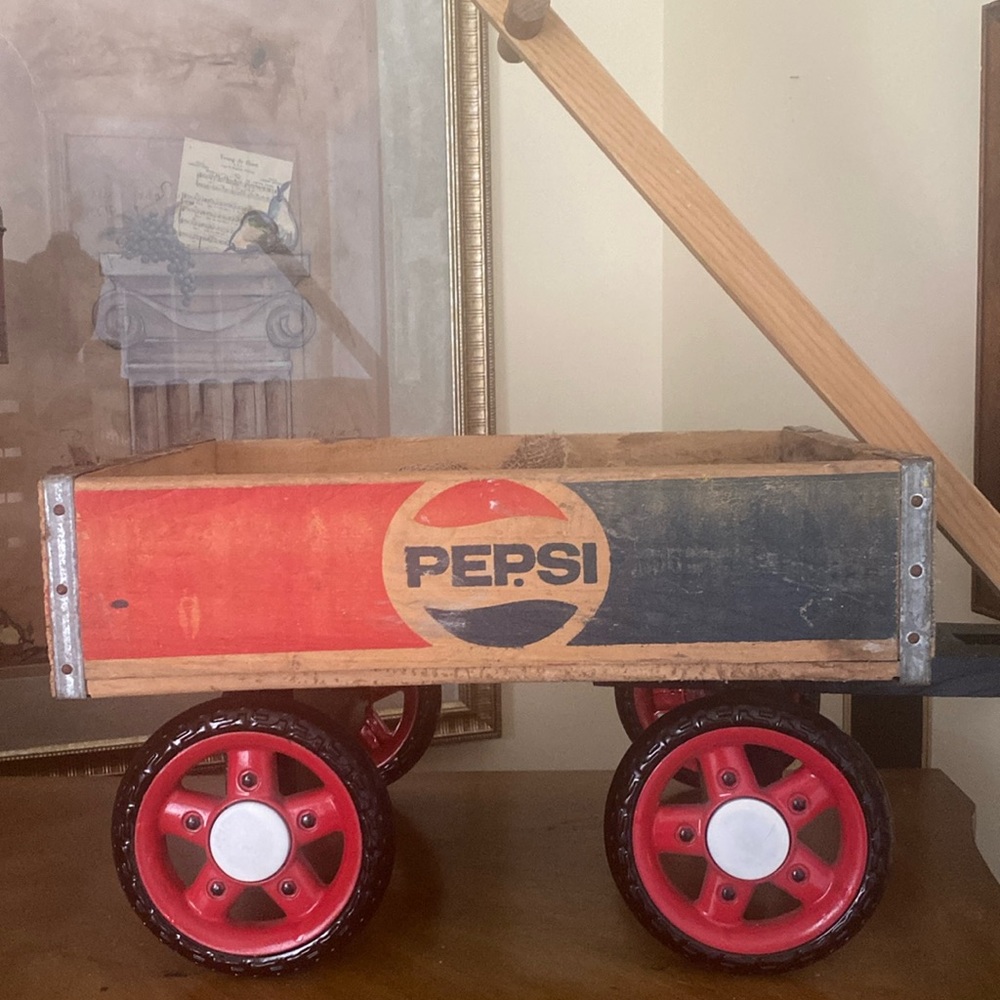 Vintage wooden Pepsi crate made into a wagon. Sturdy wheels. Very unique